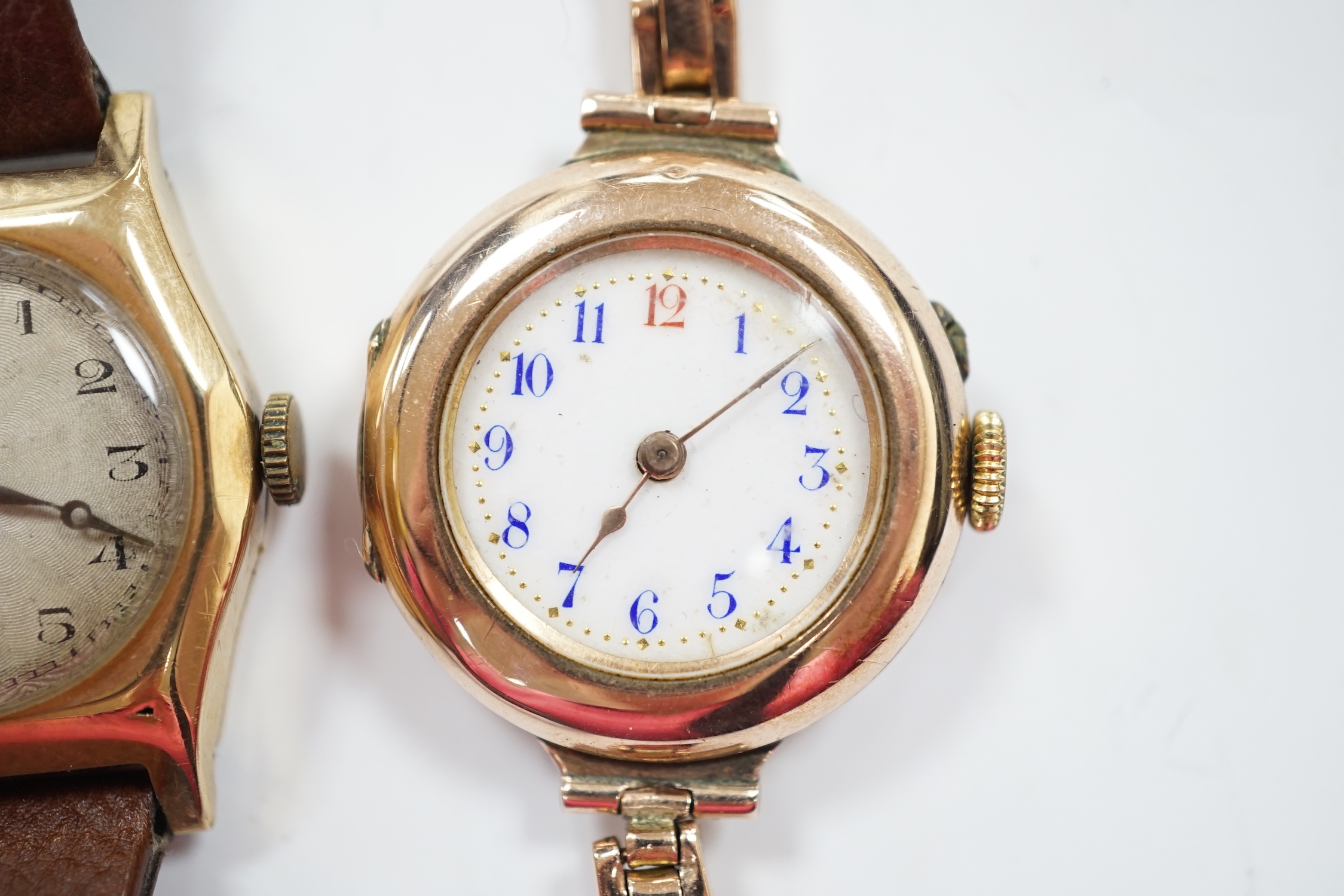 A lady's early 20th century 9k manual wind wrist watch, on an expanding 9ct bracelet(a.f.), together with a lady's 1930's 9ct Tavanne manual wind wrist watch, on a leather strap.